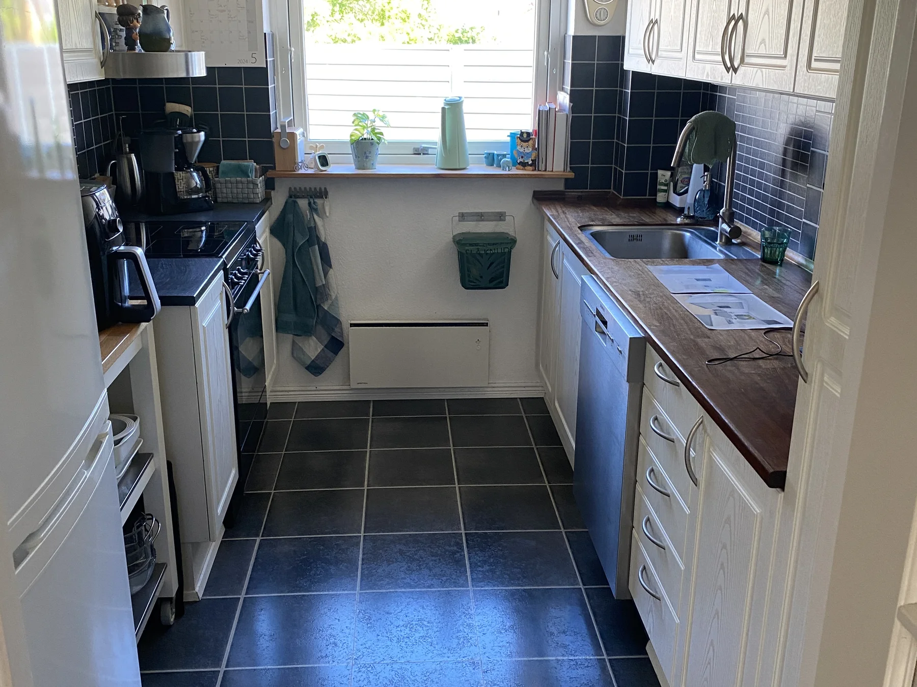 The former narrow kitchen before the wall was removed