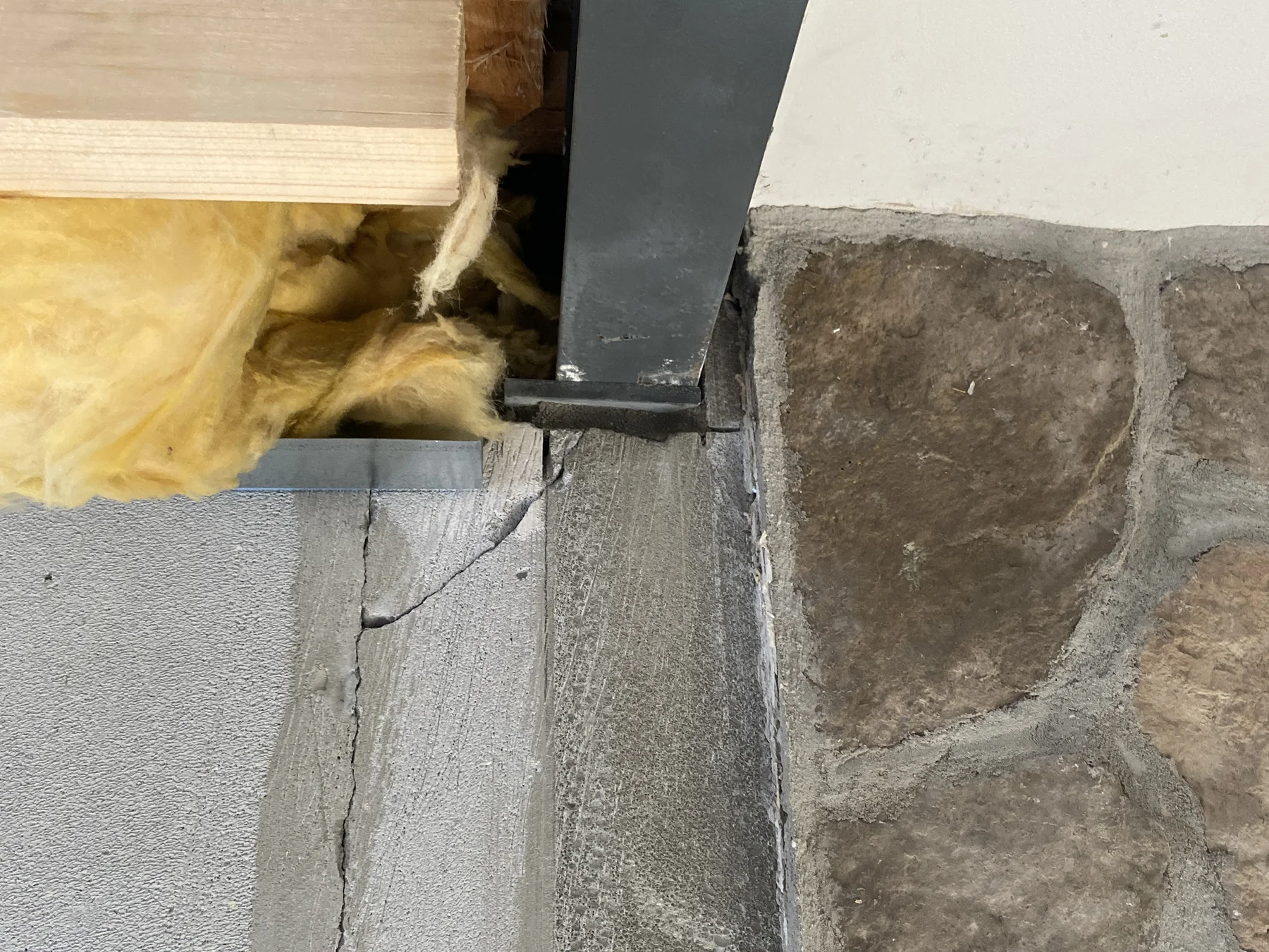 The engineered steel beam installed above the new opening